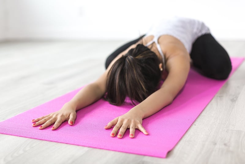 Woman practicing deep belly breathing